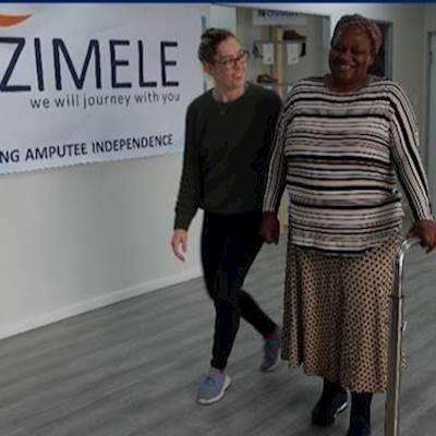 Zimele's physio working with a beneficiary