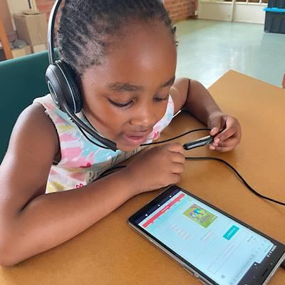 Isabella going through some challenging words with her tutor before starting her next book.