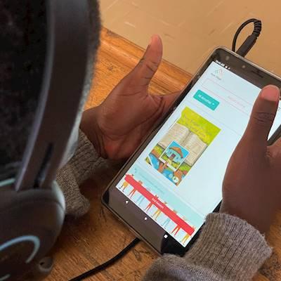 Nolwandle reading her latest book with an online tutor.