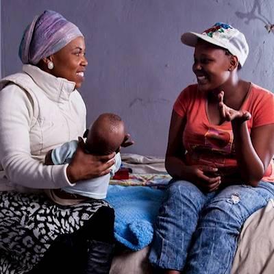 Early Childhood Community Practitioner, Florence Ramoshaba, visiting a mother at her home in Alexandra, Johannesburg