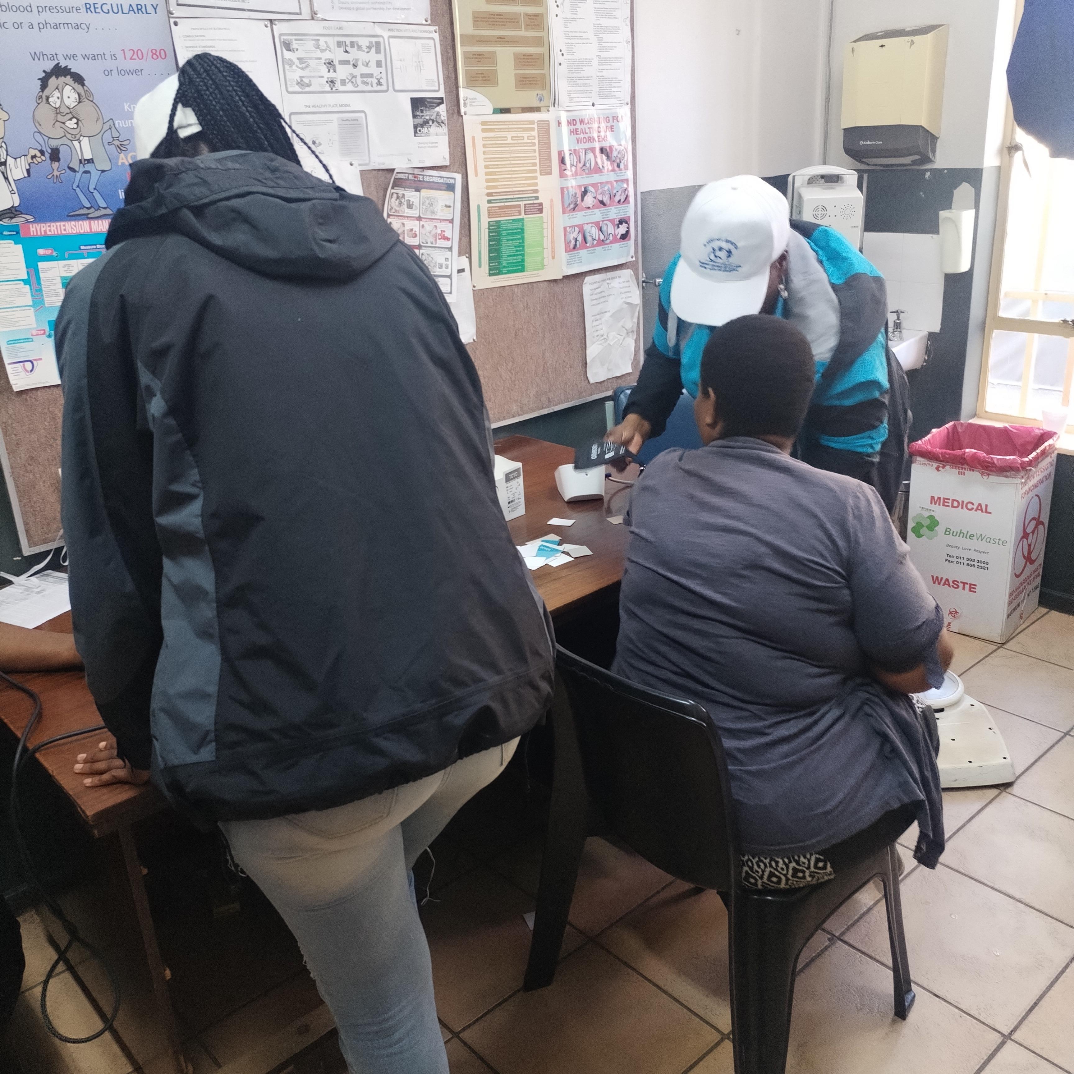 Caregivers serving at dresser clinic
