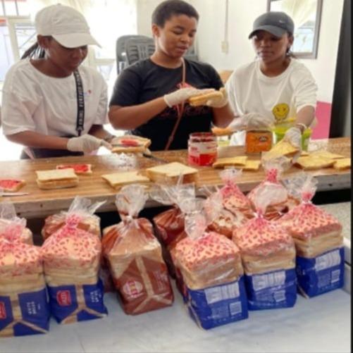 The preparation of sandwiches for the underprivileged.