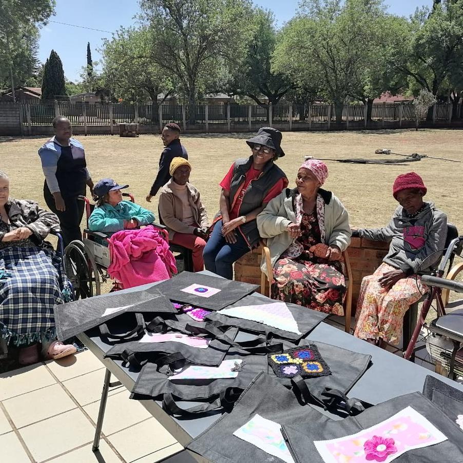 Our neighbor ( donated Cary bags for older persons at Zilisimenye Elderly Home.