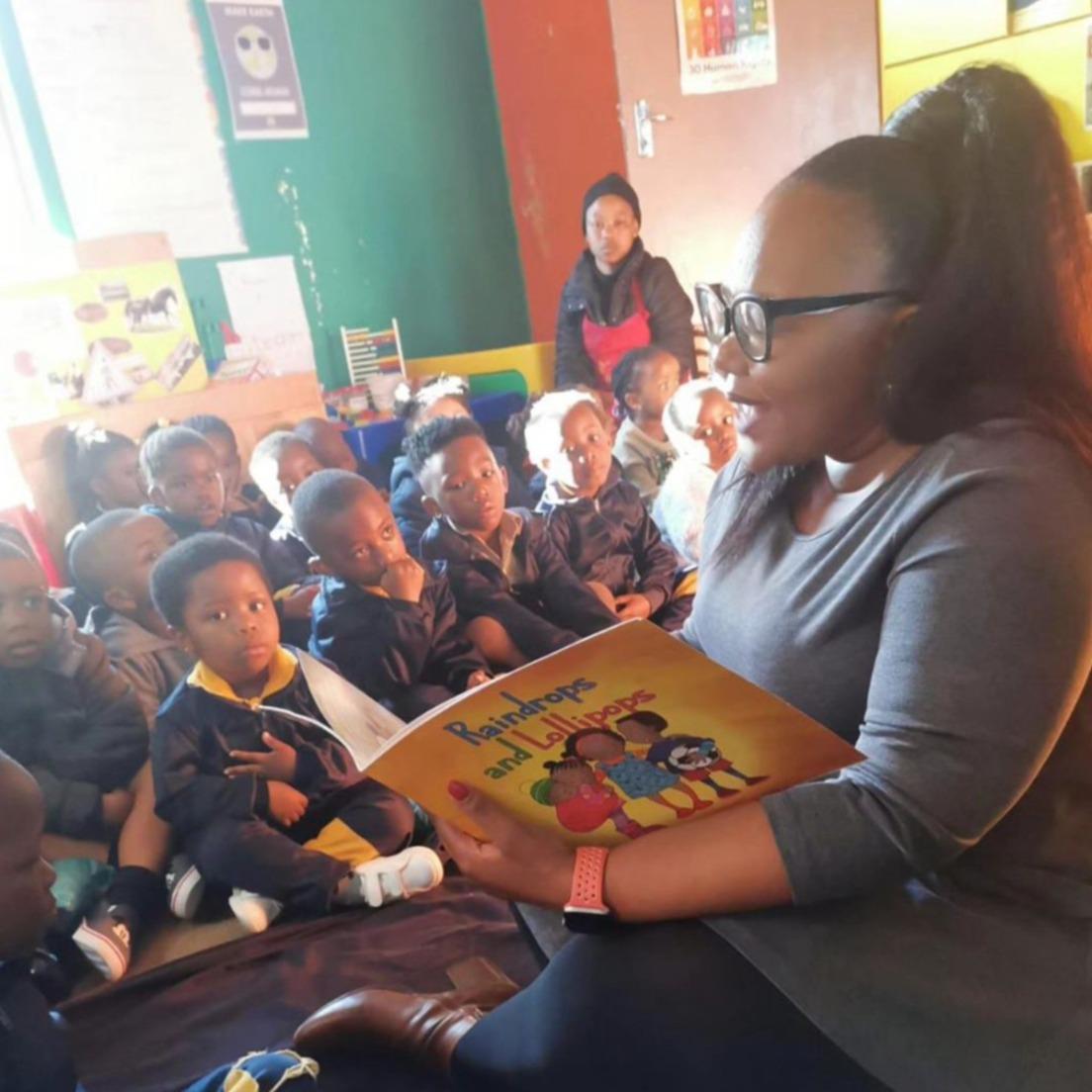 The image above is of South Africa’s Minister of Basic Education, Minister Siviwe Gwarube, who personally chose MCSA’s Story Book (Raindrops & Lollipops) to use as one of the ECD Educational books to read to the children, on visits to primary schools.