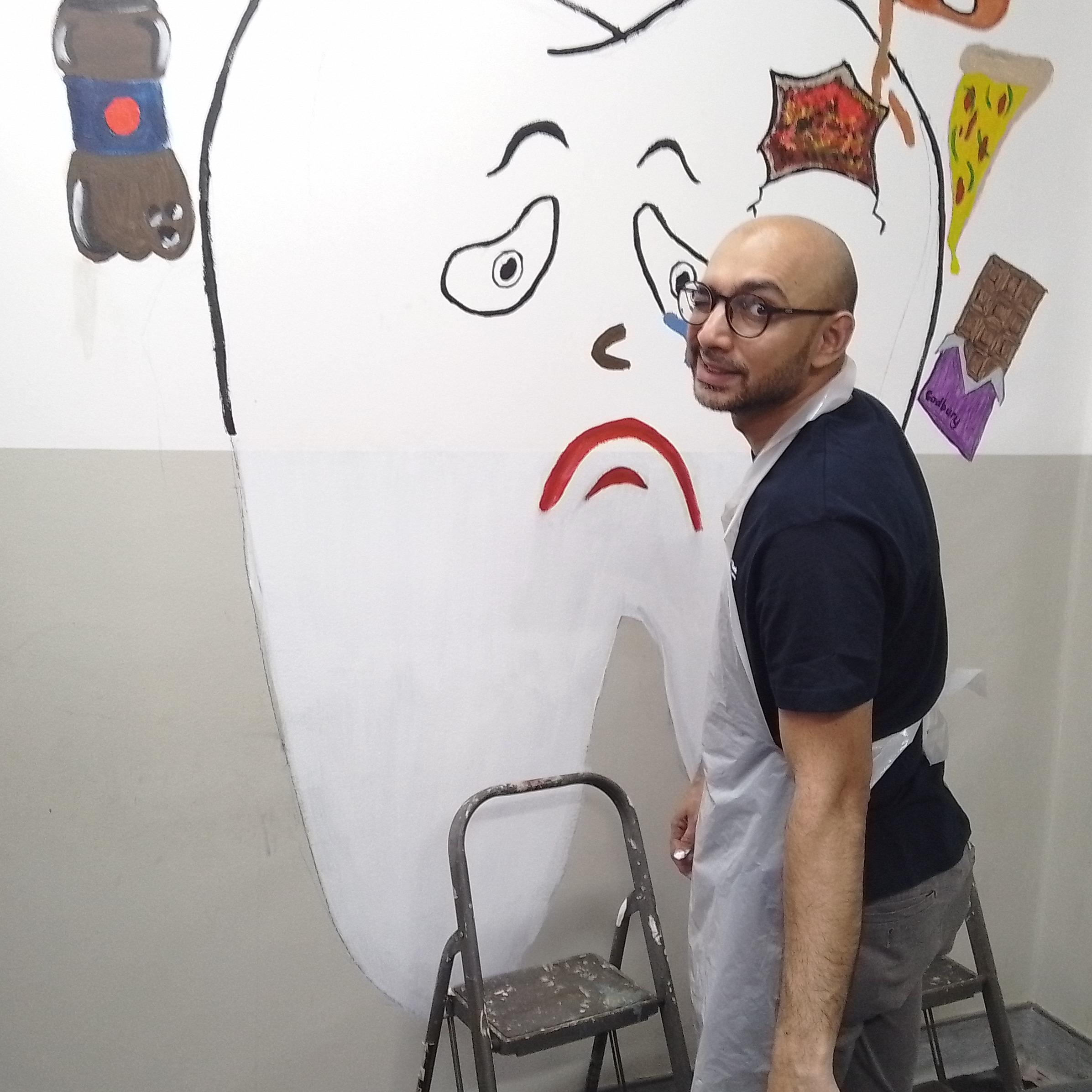 Educational mural on the foods that cause tooth decay in a children's dental clinic
