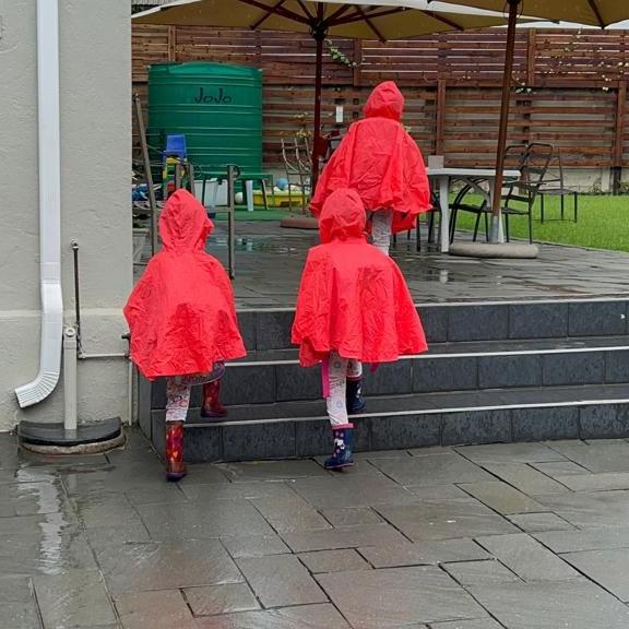 Bright raincoats on a rainy day