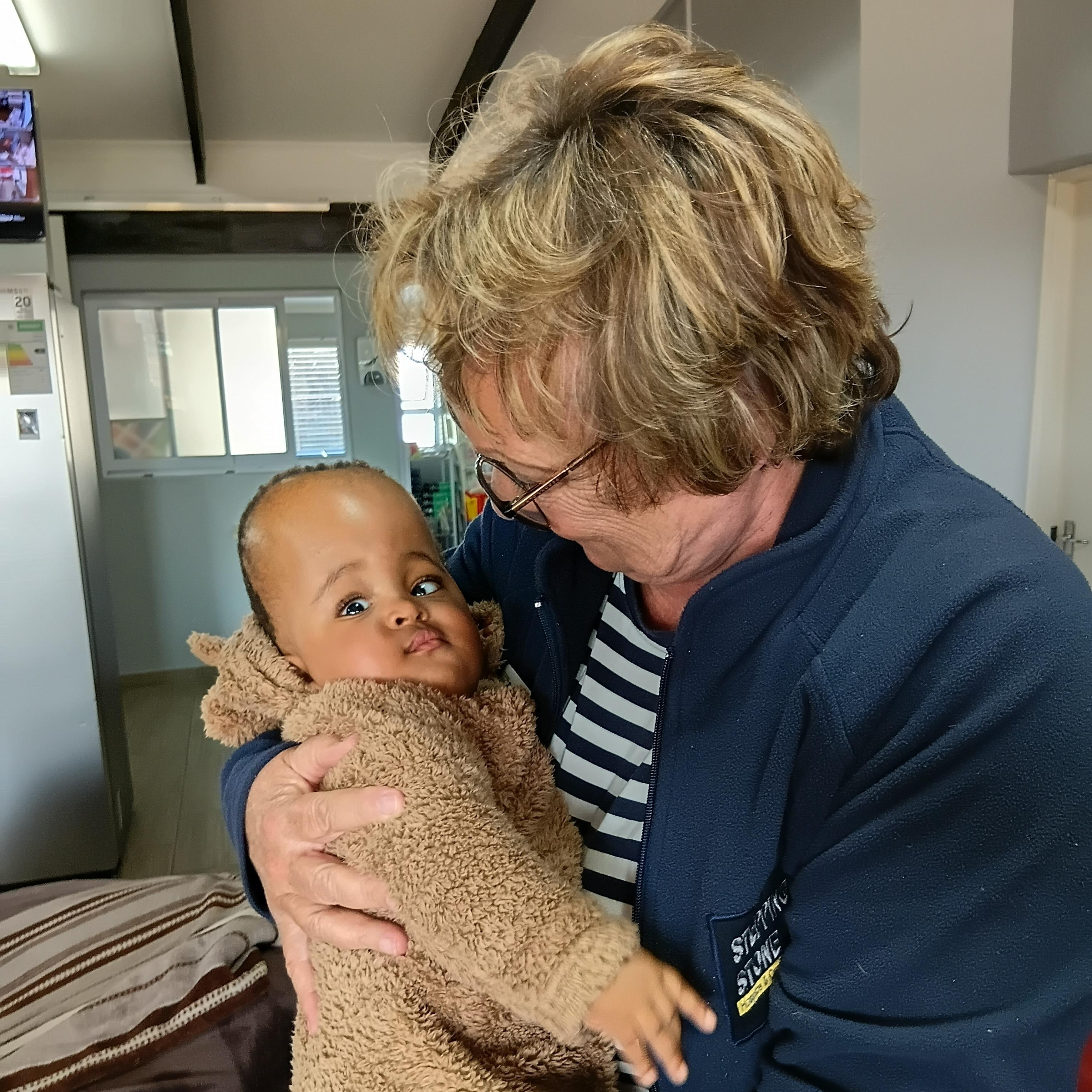 Tersia Burger, Stepping Stone Hospice CEO and Founder, with baby R at our Children's Unit.