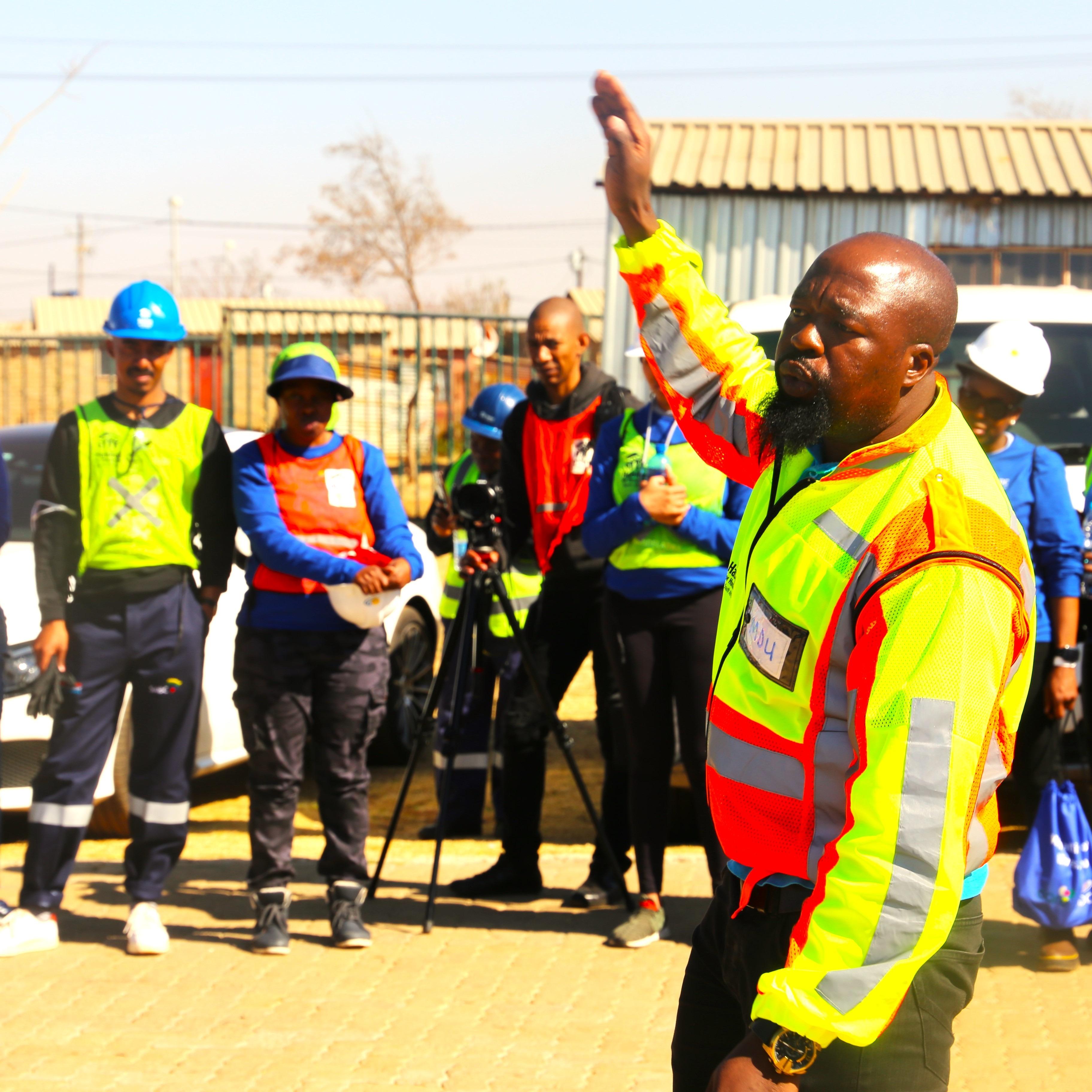 HFHSA Project Management Specialist giving 'Moon Talk' to the volunteers before the build starts