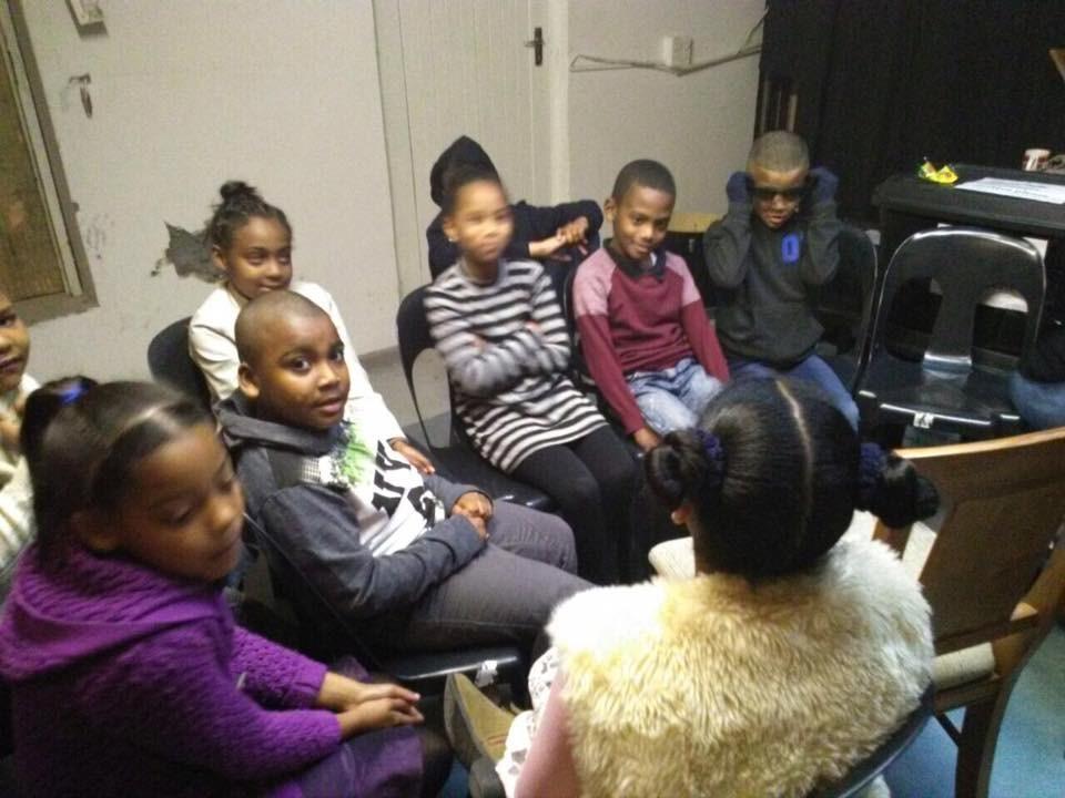 Group of juniors listening to facilitator