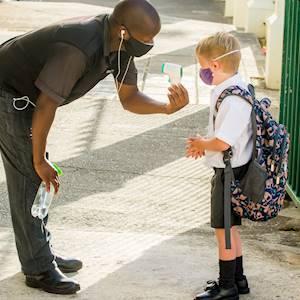 Arriving at school in the morning, Khani takes our temperature and sprays our hands and our bags with sanitizer to keep us all safe and healthy.