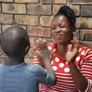 A child care worker having some one on one connecting time with one of the girls in her care