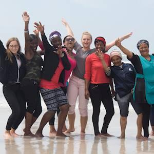 Siyazenzela Sewing and Beading women with some of our international volunteers