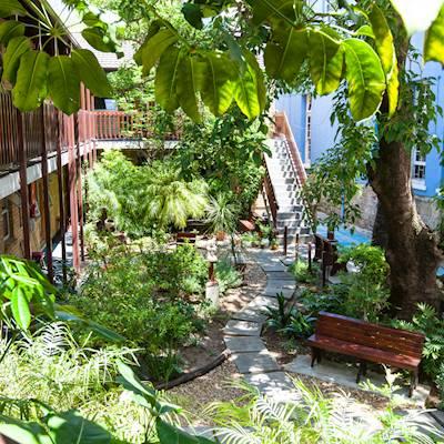 Our second-phase shelter, Geoff Burton House. Named after our founder. It can house 40 men. In front we have a beautiful garden which is used for social gatherings or for the residents to sit in peace with a cup of tea or a book.