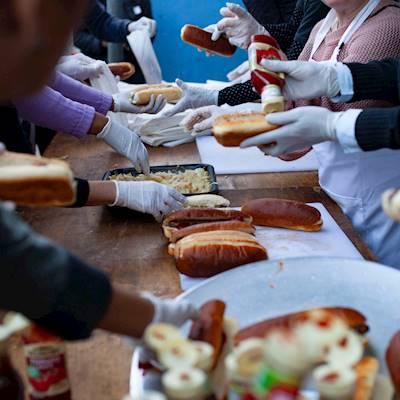 We offer meals on our premises several times a week in partnership with Ladles of Love. During the festive season we serve every single day for several weeks due to most other feeding programs close for that period.