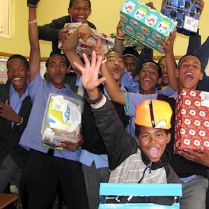 Young men expressing their sheer joy at receiving Santa Shoeboxes.