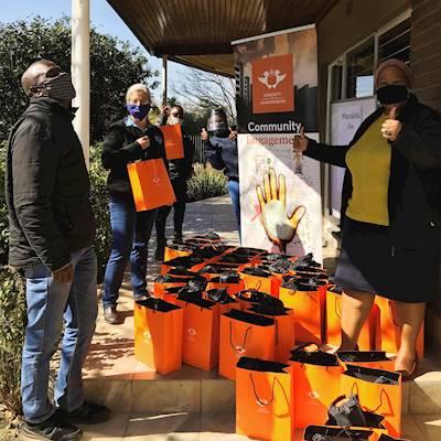 Volunteers delivering Mandela Day parcels at our offices