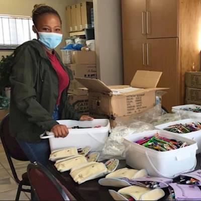 A volunteer sorts stationery at our offices