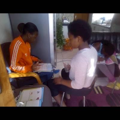 Some of the children help each other