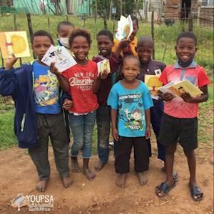 Rural children receiving their first own books