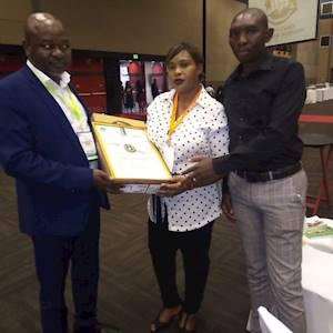 One of our top achievers, along with our Chairperson and Centre Manager, Thabani Chiya.