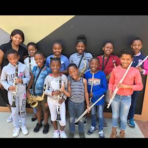 Help Morris Isaacson Centre for Music by donating 300 plain dark pastel red  golf shirts for students at Morris Isaacson Centre for Music