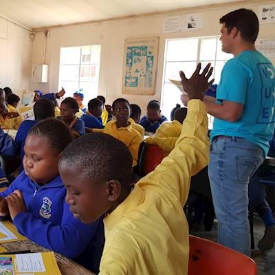Help Junior Achievement South Africa with 8 volunteers for grade 7 lessons in financial literacy