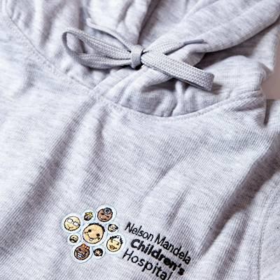 Help Nelson Mandela Children's Fund with 5 volunteers for embroidering the NMCH logo on 30 donated baby blankets